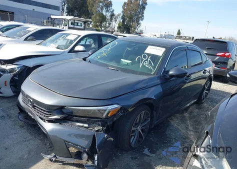 2023 Honda Civic Touring z USA, uszkodzony, nr VIN 2HGFE1F90PH304072